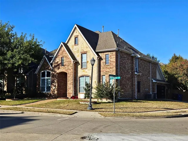 a view of a house with a street