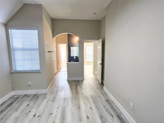 a view of a living room with a ceiling fan