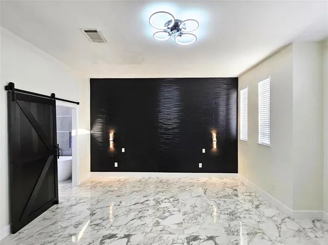 a view of an empty room with a cabinet