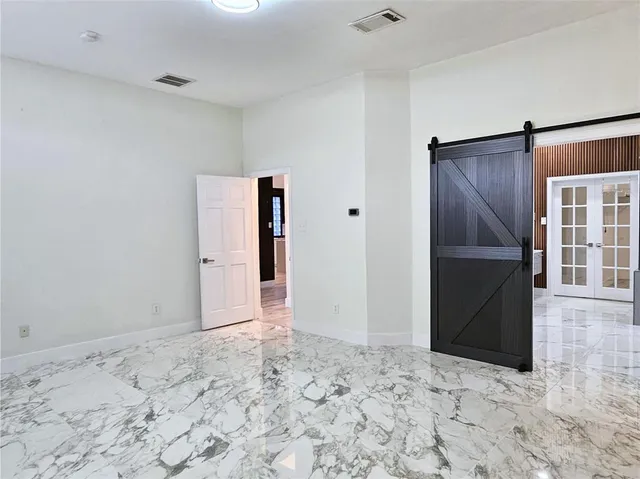 a view of a livingroom with a refrigerator
