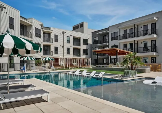 a front view of building with lake view and boat