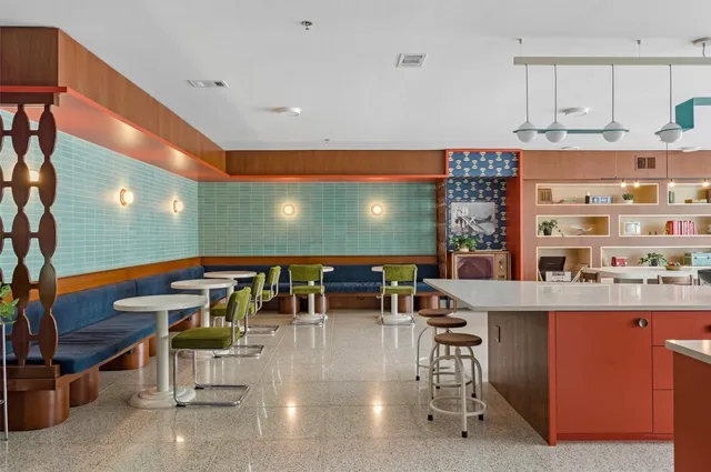 a view of lobby with furniture and chandelier