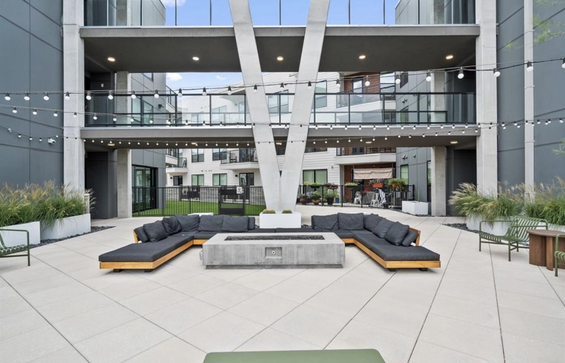 1701 Simond Avenue, Unit 513 Austin, TX 78723 - Photo 27 of 27 a building outdoor space with patio furniture and potted plants