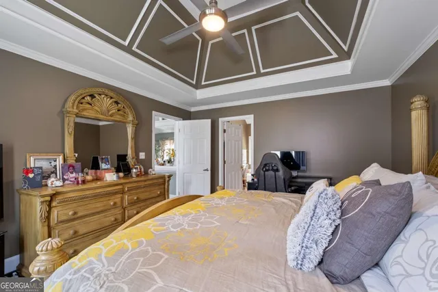 a bed room with a bed and a large mirror