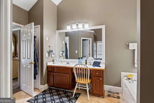 a view of a bathroom with dual sinks