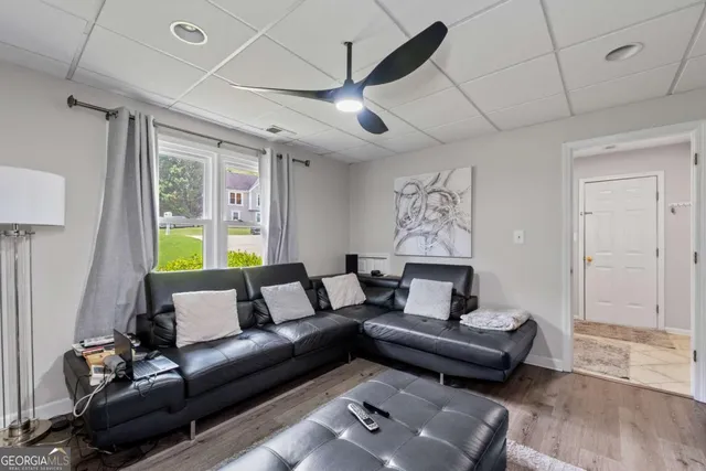 a living room with furniture and a window