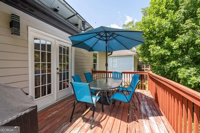 a view of balcony with outdoor seating and wooden floor
