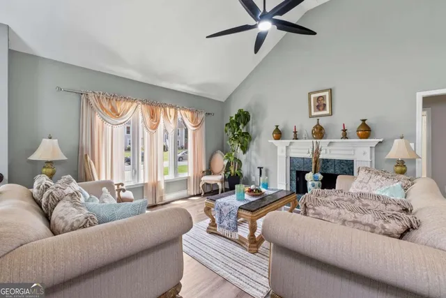 a living room with furniture and a large window