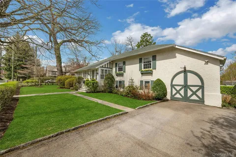 a view of a house with a backyard