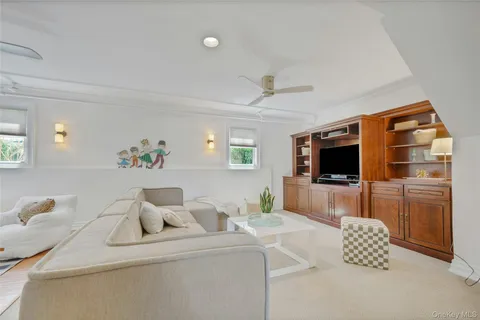 a hotel room with furniture and a flat screen tv
