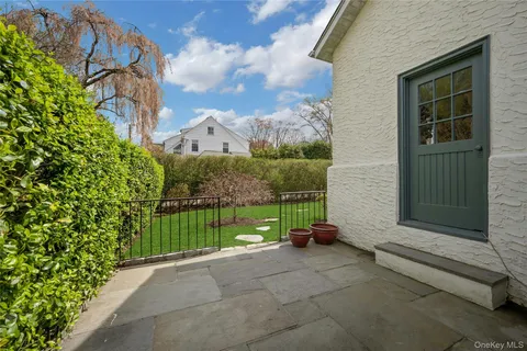 a view of backyard with tub and entertaining space