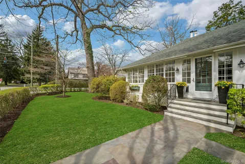 a view of a house with garden and plants