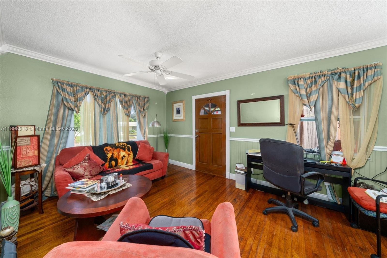 1612 Hitakee Avenue Sebring, FL 33870 - Photo 5 of 34 a living room with furniture and a flat screen tv