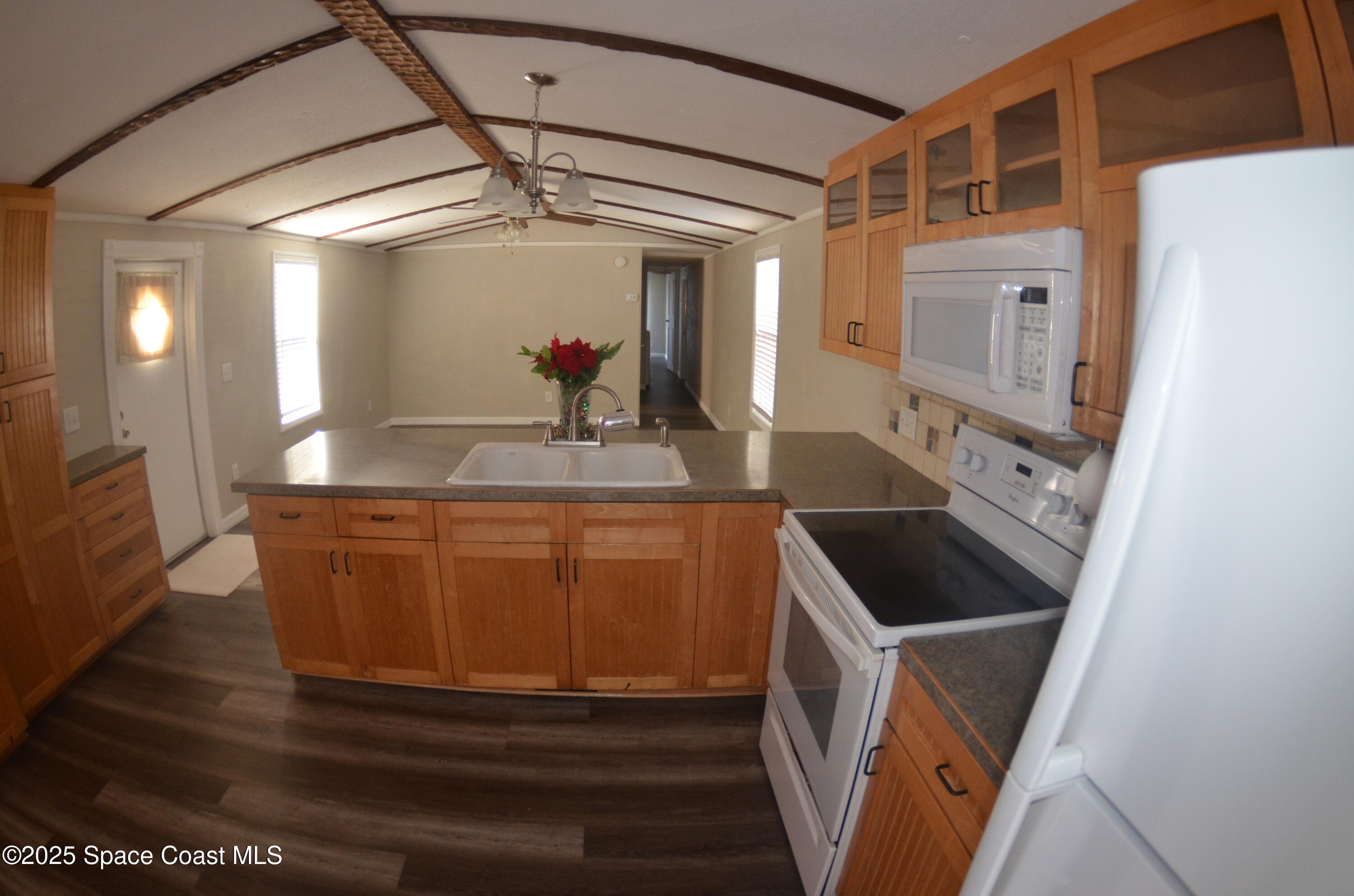 2535 Haverhill Road Northeast Palm Bay, FL 32905 - Photo 8 of 18 a bathroom with a sink a mirror and shower