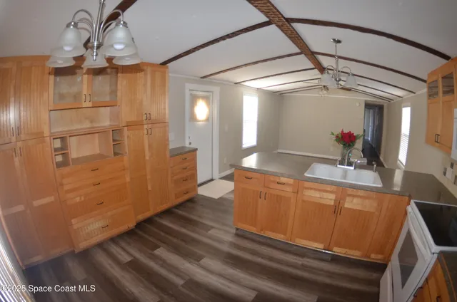 a utility room with sink dryer and washer