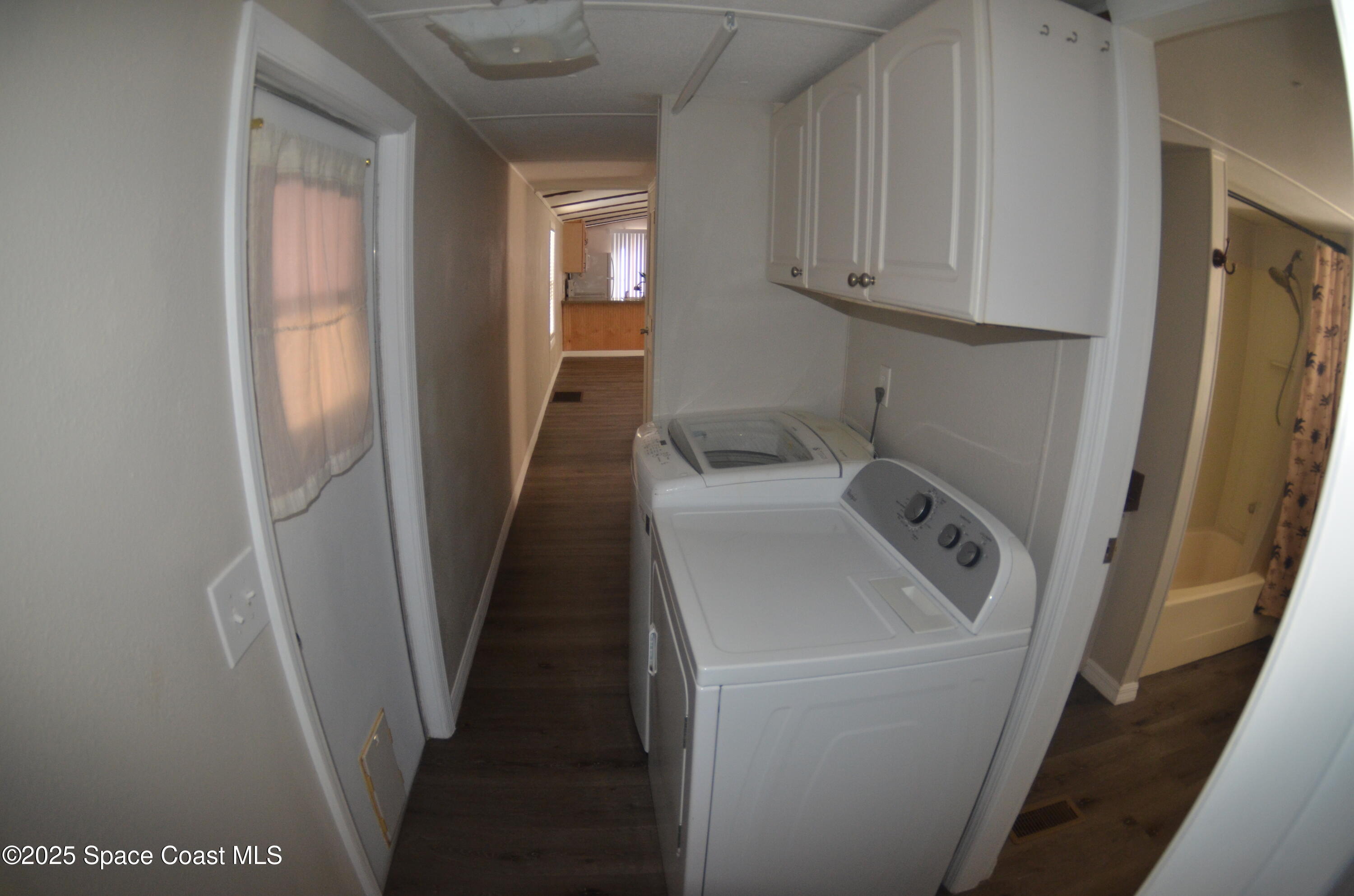 2535 Haverhill Road Northeast Palm Bay, FL 32905 - Photo 10 of 18 a utility room with sink dryer and washer