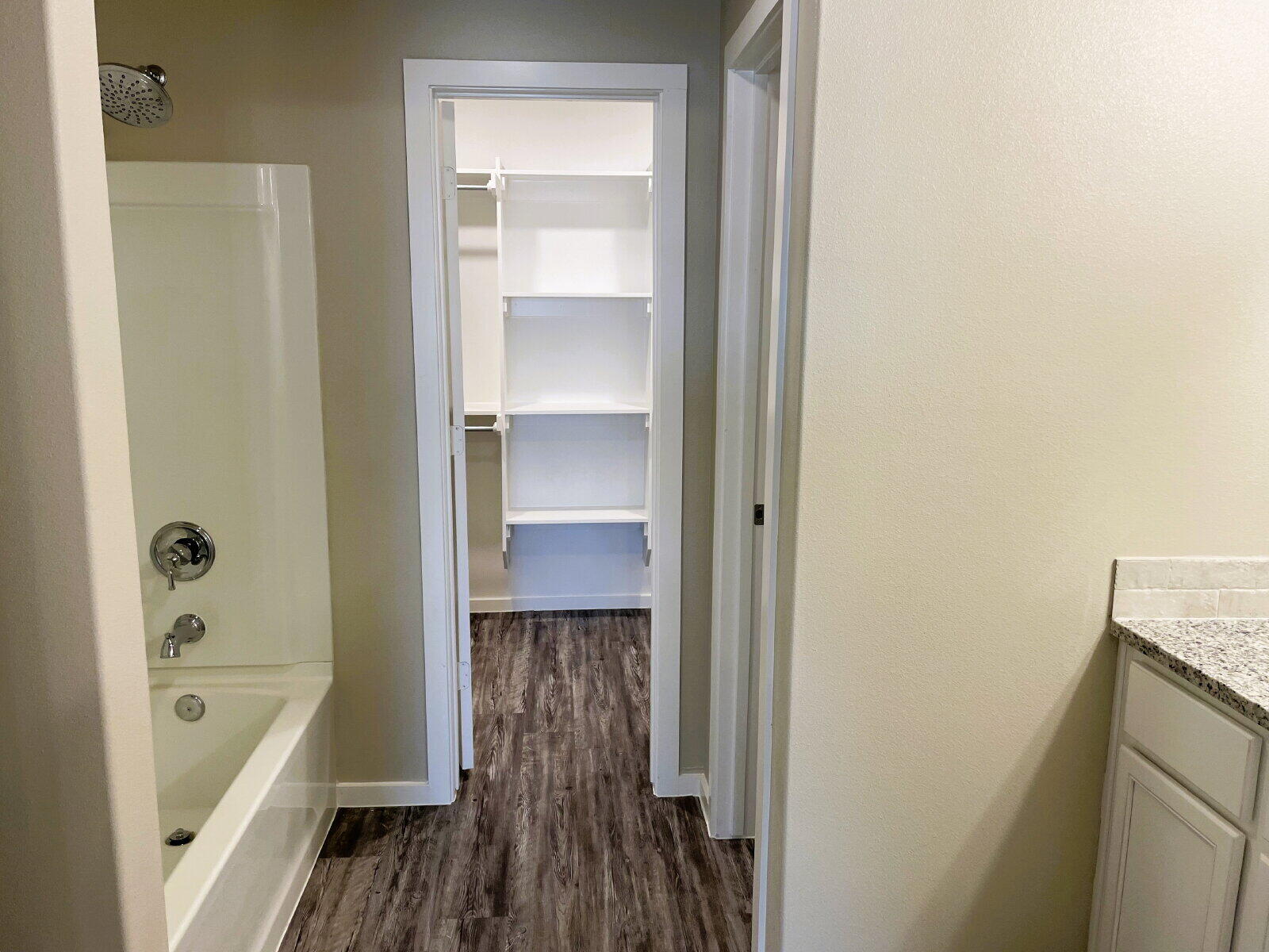 1915 Langford Avenue, Unit A Lubbock, TX 79407 - Photo 21 of 23 a bathroom with a bathtub and a shower