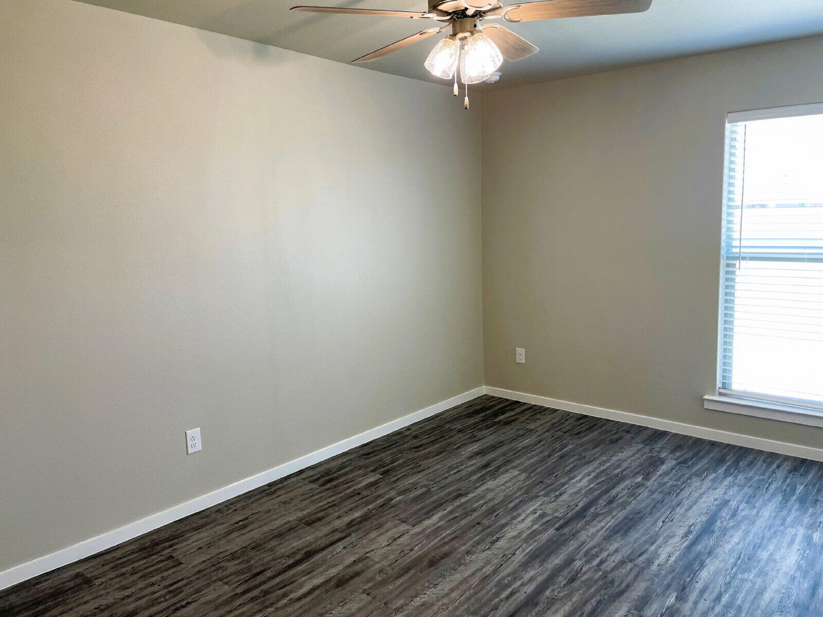 1915 Langford Avenue, Unit A Lubbock, TX 79407 - Photo 22 of 23 an empty room with a window
