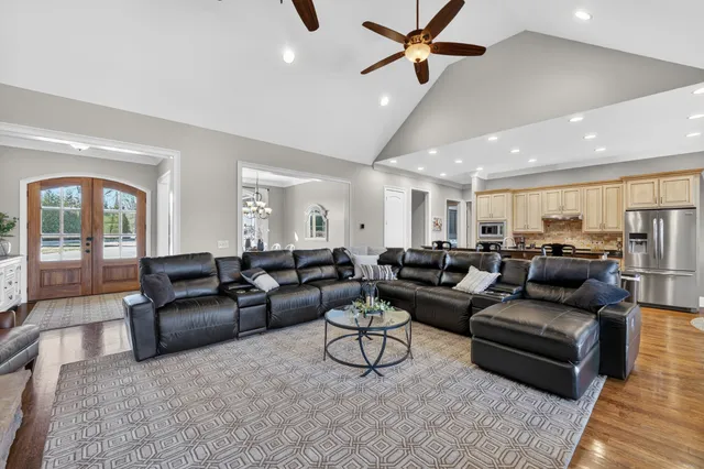 a living room with furniture fireplace and a flat screen tv
