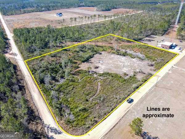 a view of a small yard with an outdoor seating