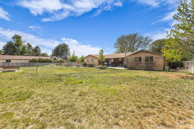 10705 Green Ridge Drive Sandy, UT 84070 - Photo 47 of 55 Fenced backyard featuring a patio