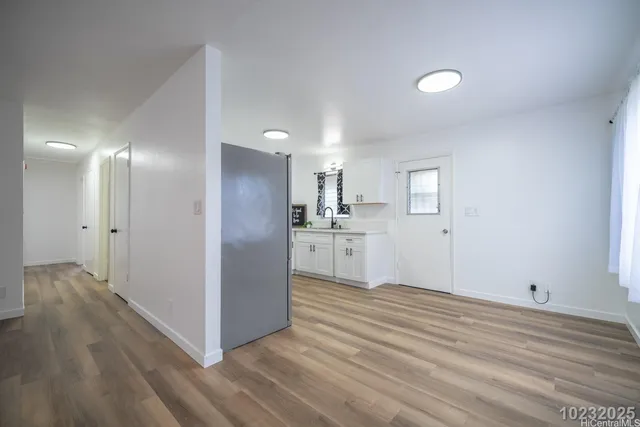 a kitchen with a refrigerator stove and a sink