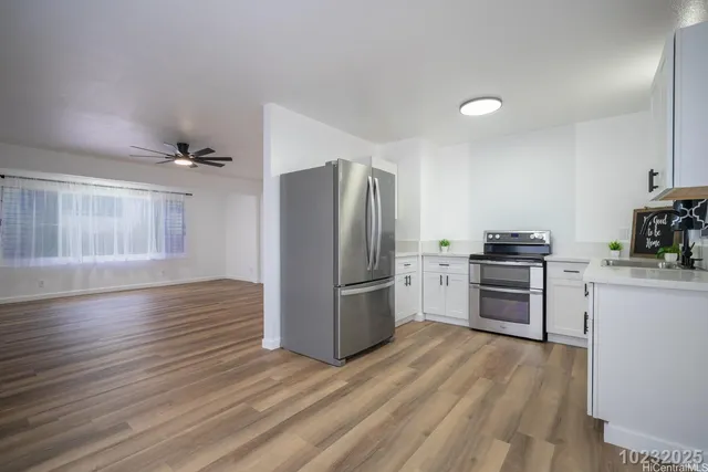a kitchen with cabinets and appliances