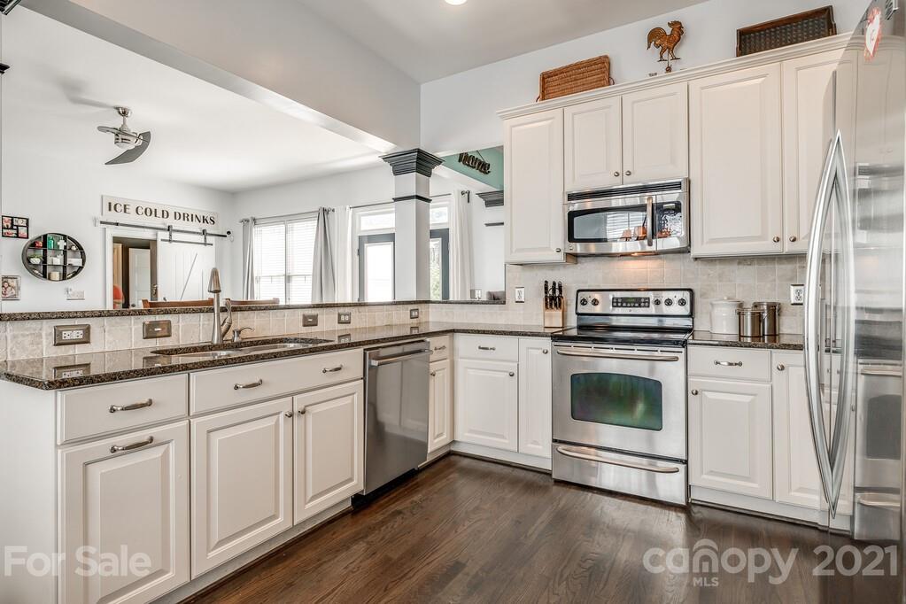 712 Bath Court Fort Mill, SC 29708 - Photo 13 of 42 a kitchen with appliances a sink and cabinets