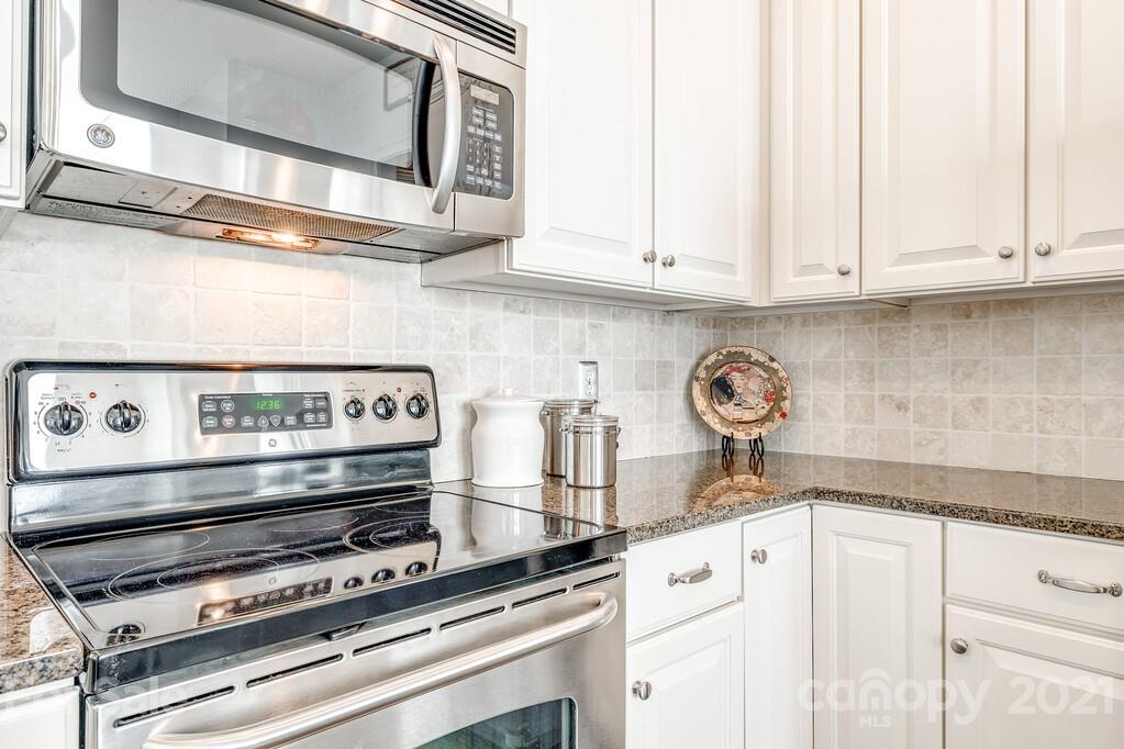 712 Bath Court Fort Mill, SC 29708 - Photo 15 of 42 a kitchen with appliances a stove and cabinets