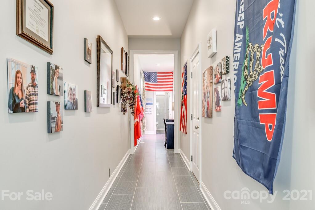 712 Bath Court Fort Mill, SC 29708 - Photo 19 of 42 a view of a hallway with lots of stuff