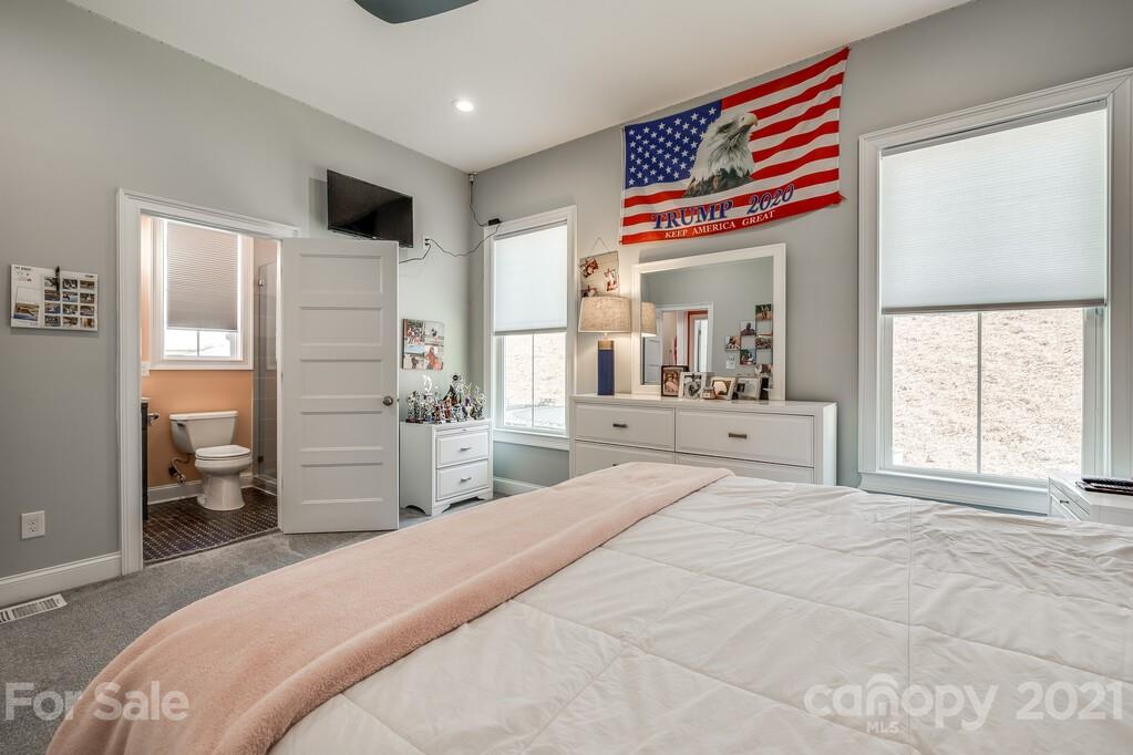 712 Bath Court Fort Mill, SC 29708 - Photo 24 of 42 a bedroom with a bed and a large window