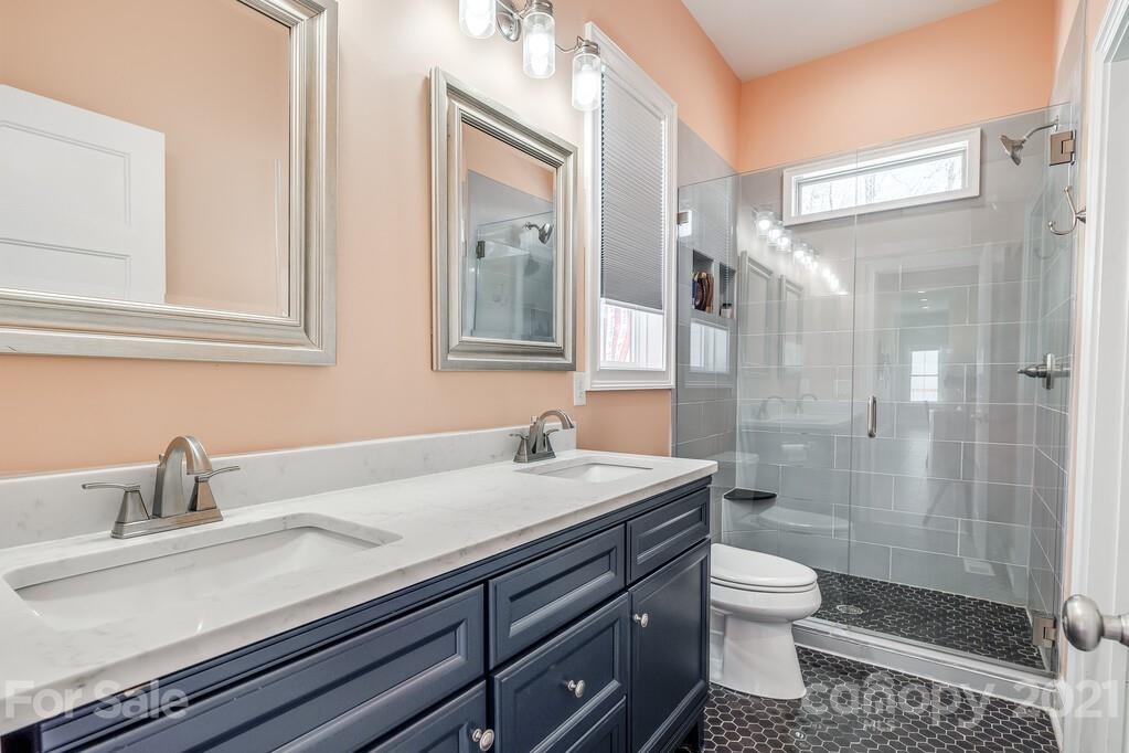 712 Bath Court Fort Mill, SC 29708 - Photo 25 of 42 a bathroom with a sink a toilet and shower