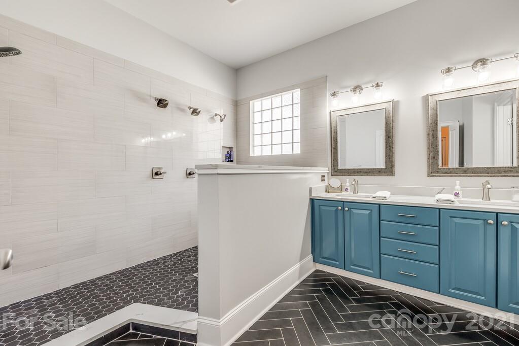 712 Bath Court Fort Mill, SC 29708 - Photo 27 of 42 a bathroom with a sink and a mirror