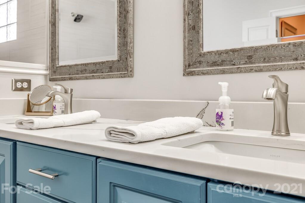 712 Bath Court Fort Mill, SC 29708 - Photo 28 of 42 a bathroom with a sink and a mirror