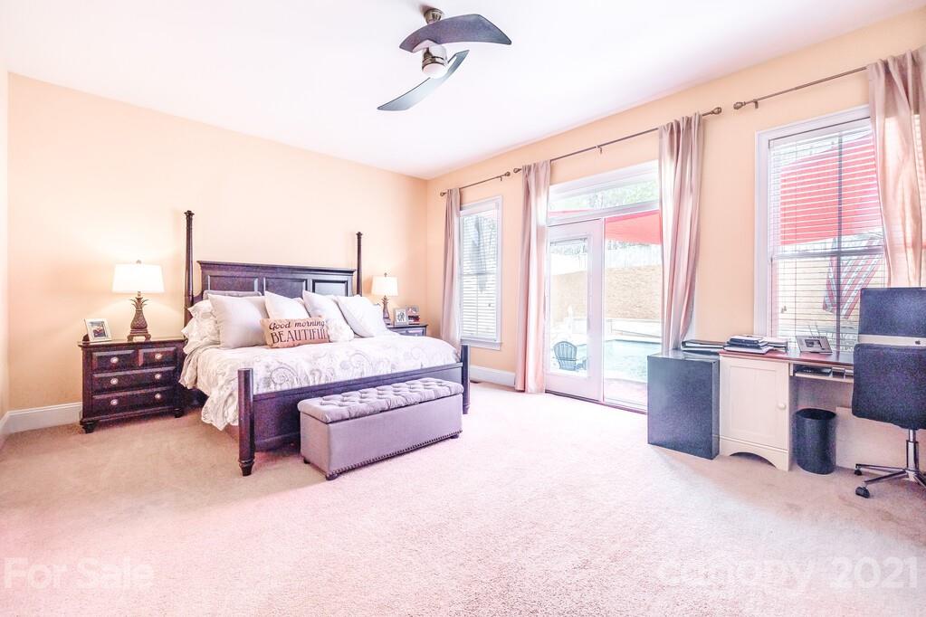 712 Bath Court Fort Mill, SC 29708 - Photo 31 of 42 a spacious bedroom with a bed and a couch