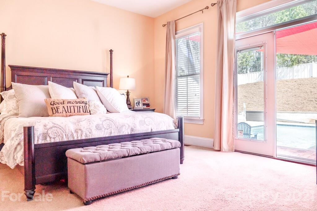 712 Bath Court Fort Mill, SC 29708 - Photo 32 of 42 a bedroom with a large bed and a large window