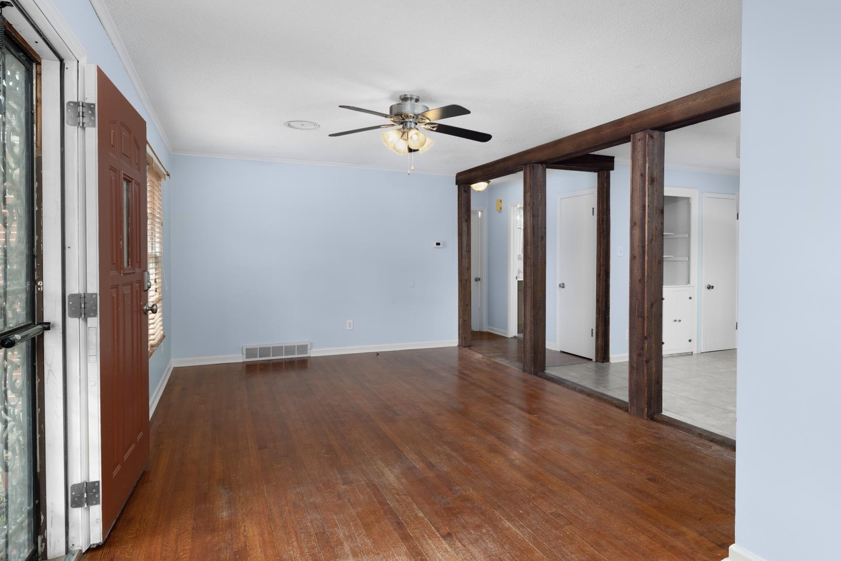 5364 Virgil Road Bartlett, TN 38134 - Photo 11 of 32 Spare room with dark wood-style flooring, ornamental molding, and ceiling fan