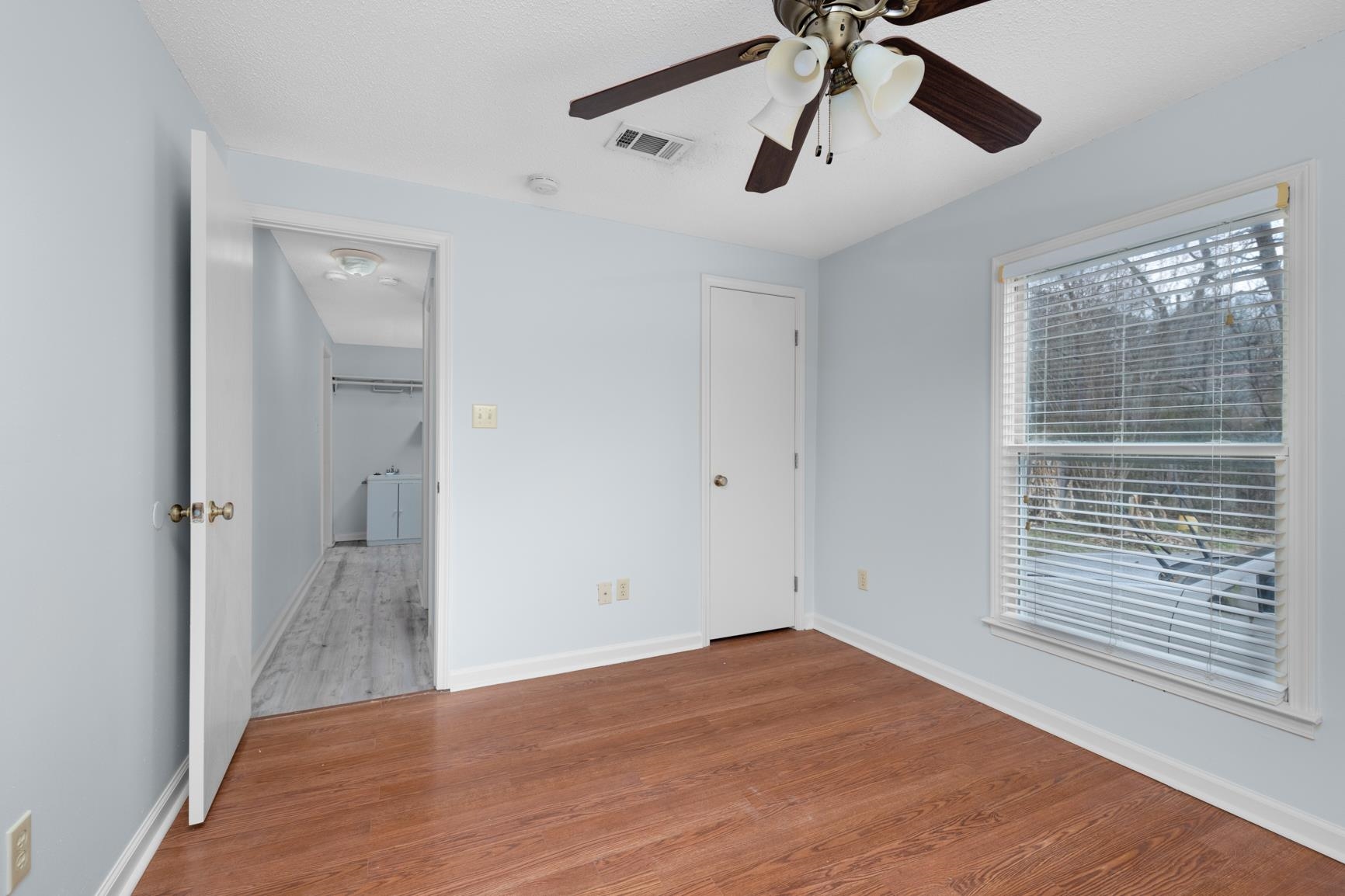 5364 Virgil Road Bartlett, TN 38134 - Photo 24 of 32 Unfurnished bedroom with wood finished floors and a ceiling fan