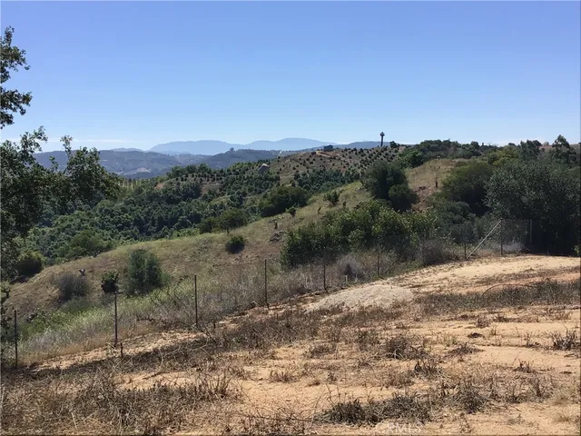 a view of a yard with a mountain