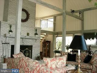 21 Brandon Road West Pennington, NJ 08534 - Photo 6 of 6 a view of a livingroom with furniture and a fireplace