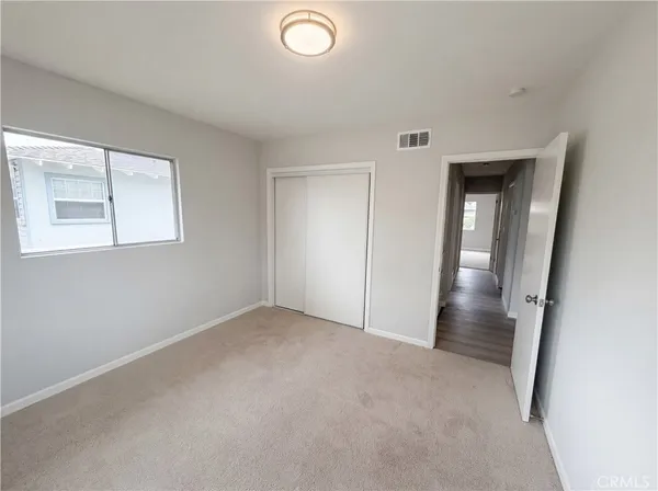 an empty room with a mirror