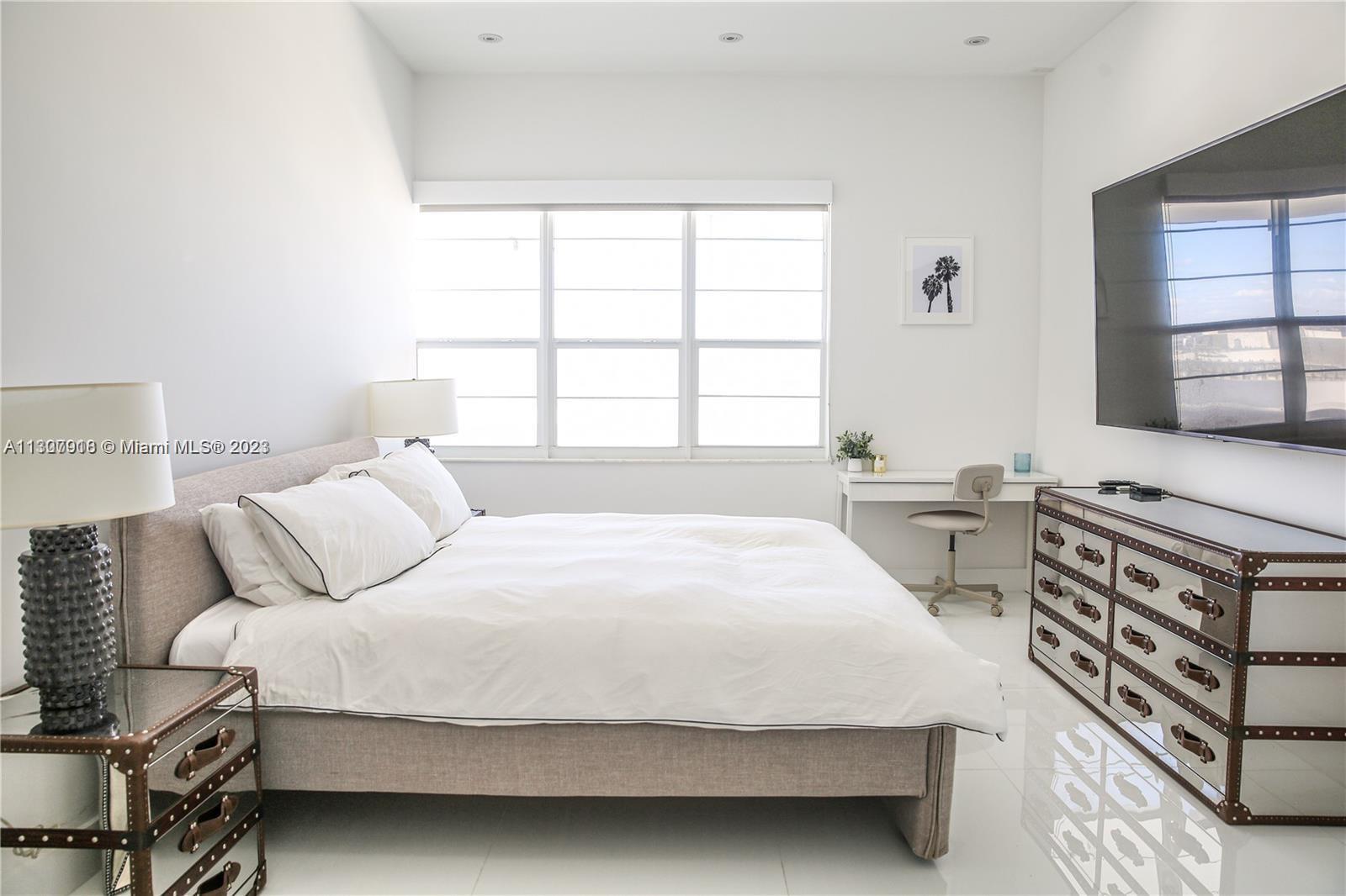 100 Lincoln Road, Unit 1643 Miami Beach, FL 33139 - Photo 6 of 7 a bedroom with a bed and a window