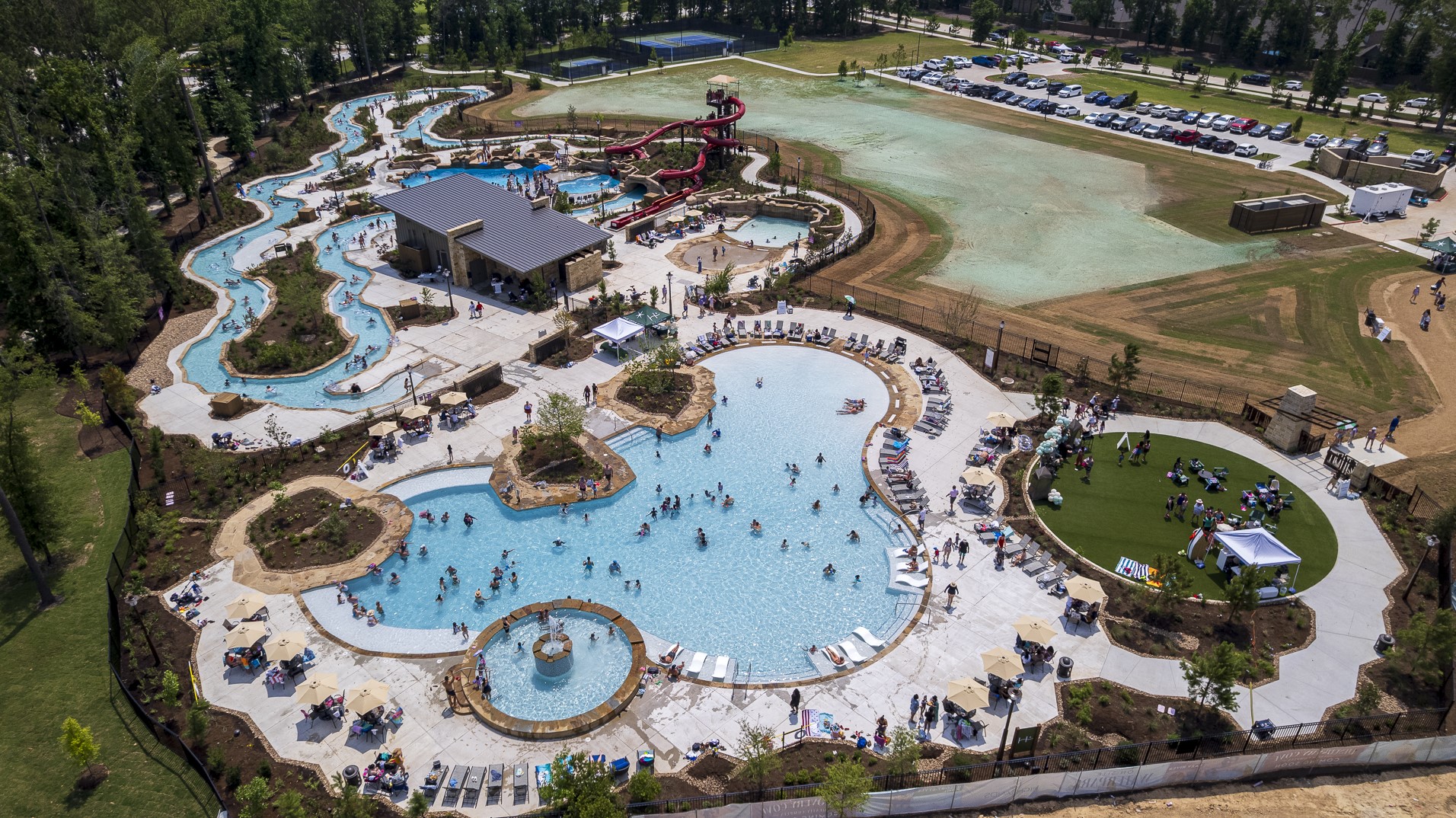 21702 Leaton Circle Porter, TX 77365 - Photo 36 of 36 Make a splash at Discovery Cove—the brand-new resort-style pool in The Highlands. Featuring waterslides, splash zones, and plenty of lounge space, it’s the ultimate destination for fun and relaxation.