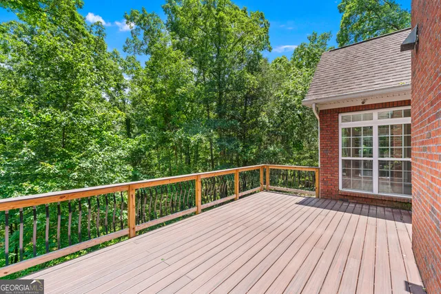a view of balcony with deck and wooden floor