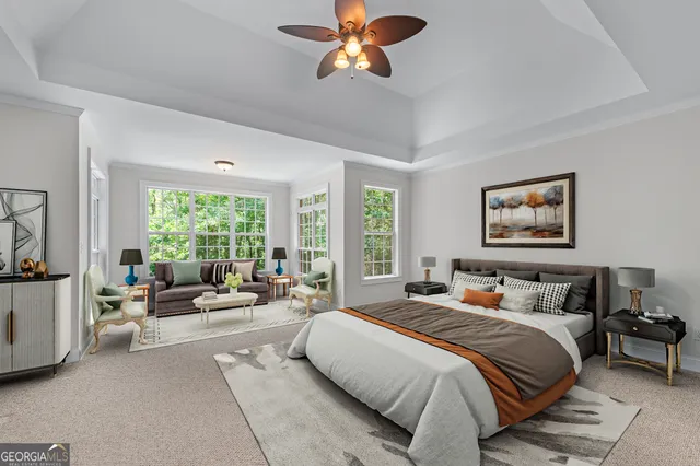 a bedroom with a bed couch and window