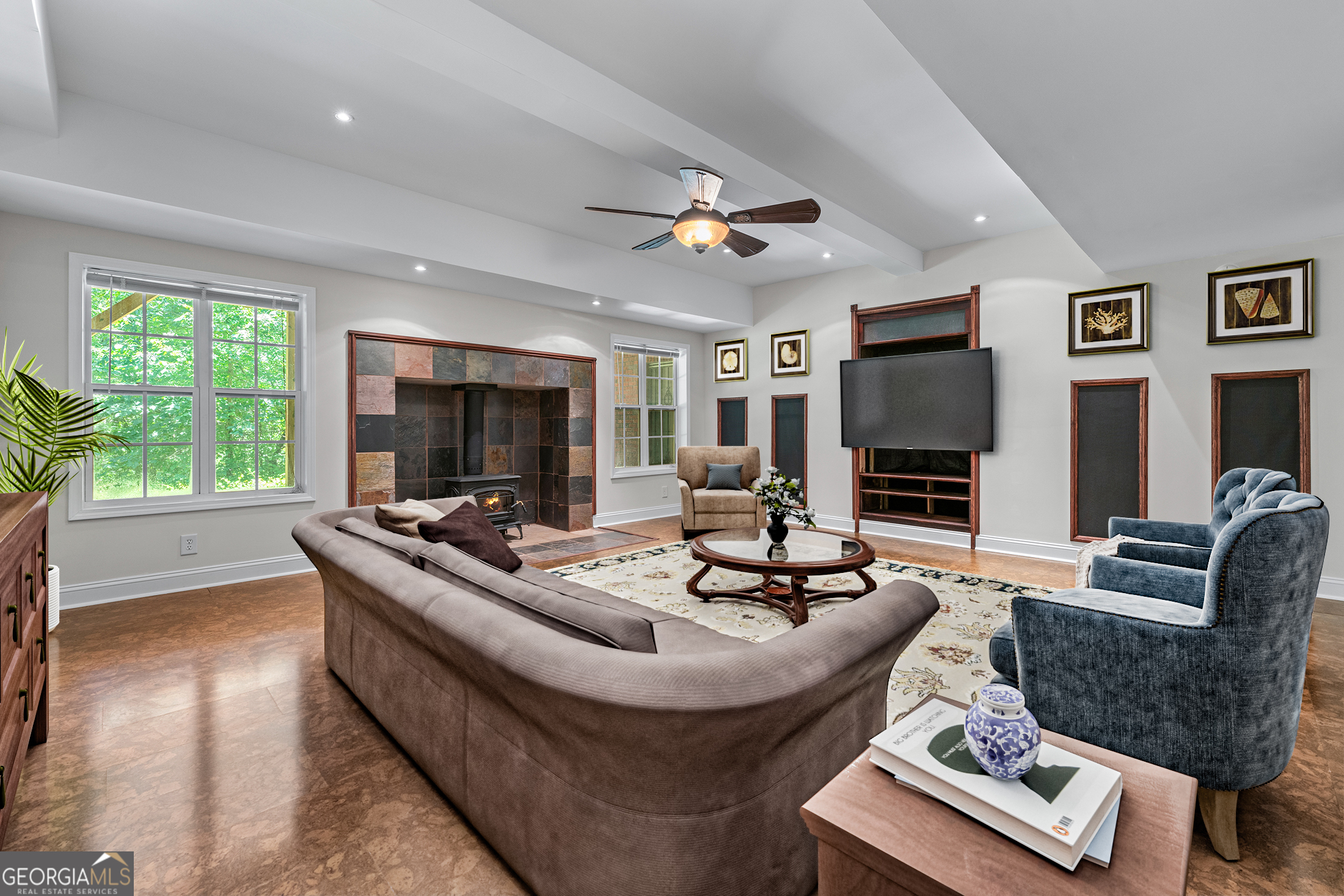 6020 Cochran Mill Road Chattahoochee Hills, GA 30213 - Photo 32 of 44 a living room with furniture and a flat screen tv