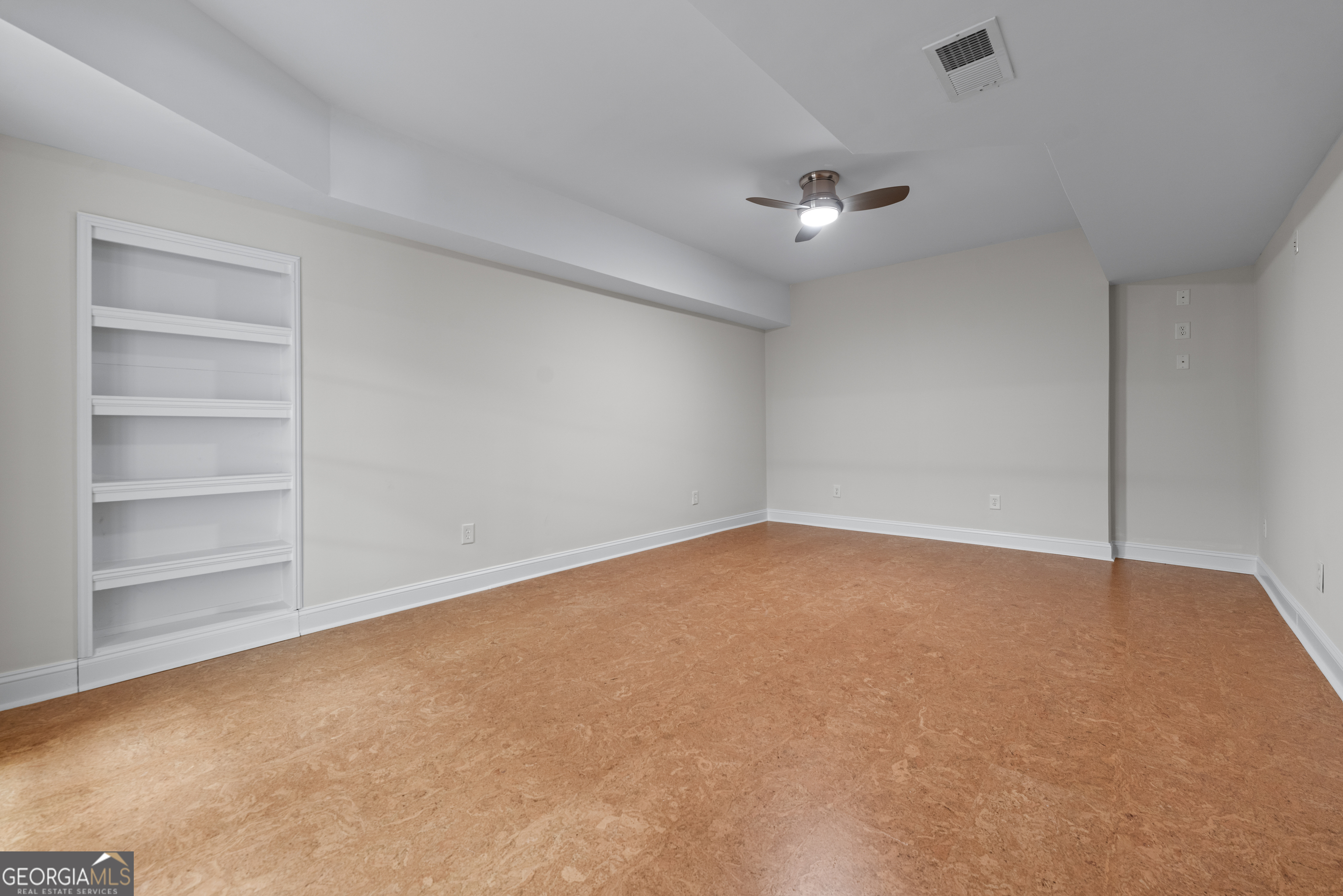 6020 Cochran Mill Road Chattahoochee Hills, GA 30213 - Photo 33 of 44 a view of an empty room with a ceiling fan