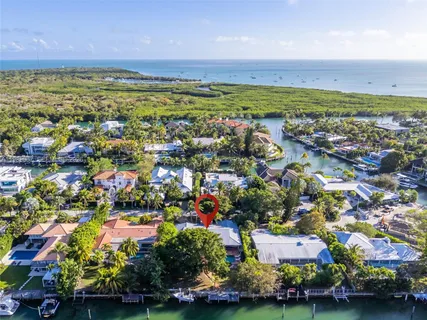 an aerial view of residential building and ocean