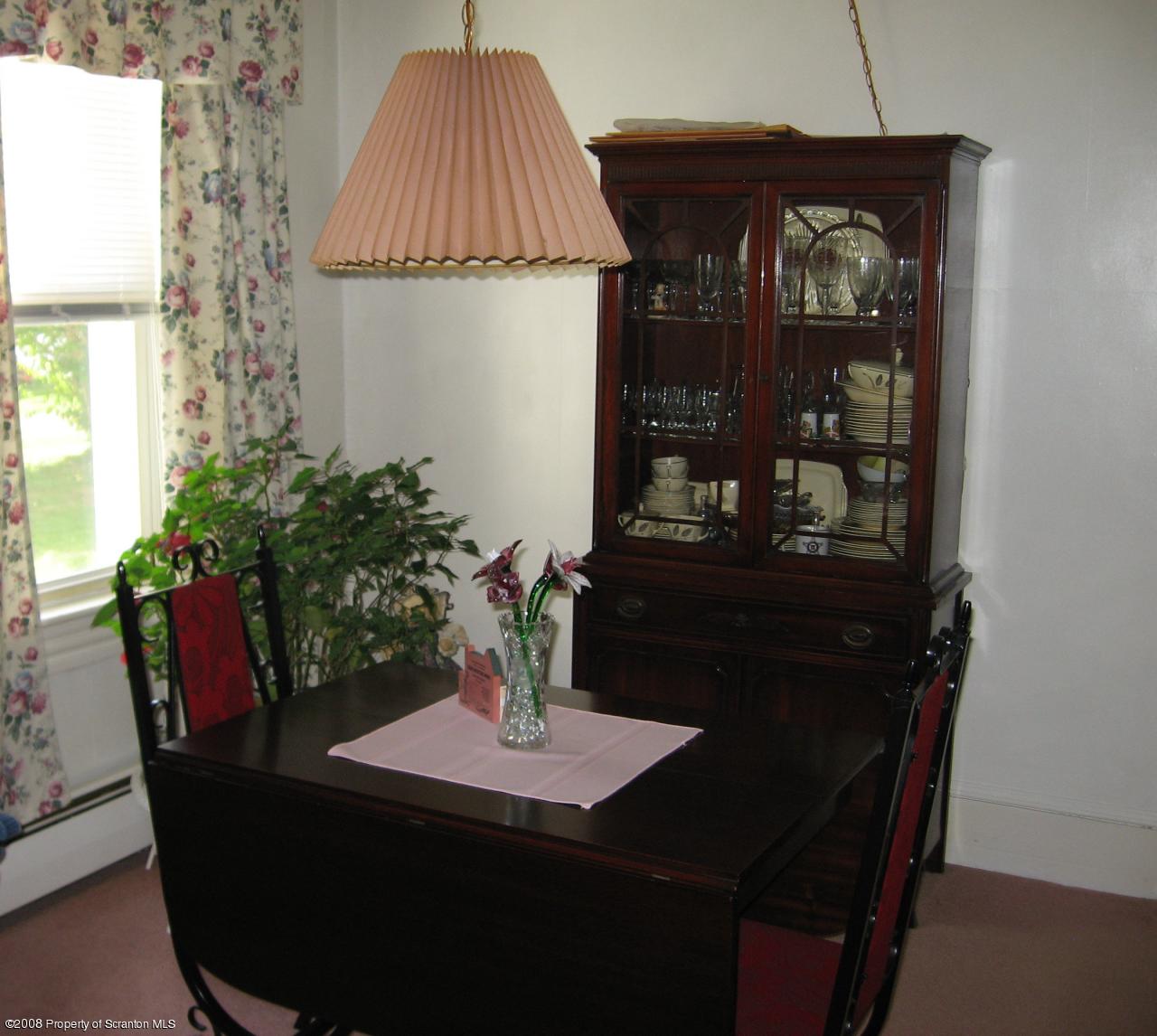 4050 Bear Brook Road Moscow, PA 18444 - Photo 4 of 8 a dining room with furniture and wooden floor