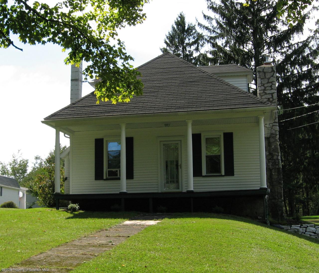 4050 Bear Brook Road Moscow, PA 18444 - Photo 8 of 8 a view of a house with a yard